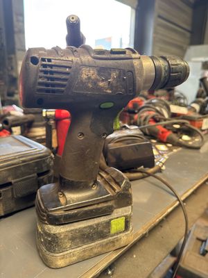 a drill that is sitting on top of a table