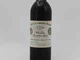 an image of a bottle of wine sitting on top of a table