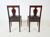 pair of antique mahogany chairs with green leather upholstered seats