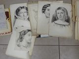 a lot of old books on the floor with pictures on them