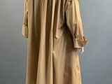 a brown trench coat on a mannequin mannequin mannequin mannequin mannequin mannequin mannequin mannequin manne