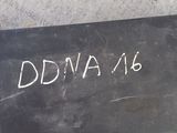a black board with writing on it sitting on the ground