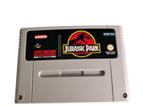 an image of a gameboy with a jurassic park sticker on it