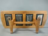 a wooden bench that has a bunch of bottles on it