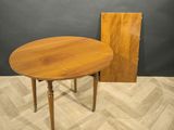 an image of a wooden table with a wooden door in the background