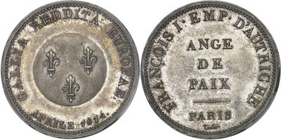 une vieille pièce d'argent sur laquelle figure une fleur de paix