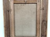 a close up of a wooden picture frame with a white background