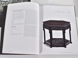 an open book with a picture of a table on it