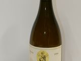 a bottle of wine that is sitting on a table