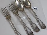 six forks and spoons sitting on a table with a price tag