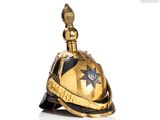 an image of a gold and black helmet on a white background