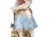 a figurine of a woman with a dog