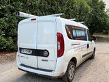 a white van that is parked on the side of the road