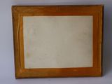 an old picture frame with a picture of a cat on it