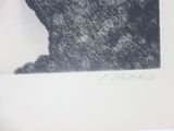 a black and white picture of a cat sitting on a table