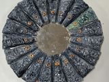 a circular mirror that has been made out of marble