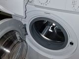 a washing machine that is sitting on the floor