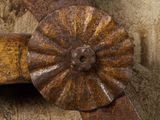 an image of a close up of a metal object on a wooden surface