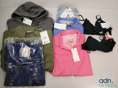 a lot of clothes that are sitting on a table