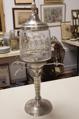 a silver cup sitting on a table in a room