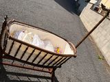 a baby in a basket that is on the side of the road