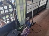a surfboard and a vacuum in a room
