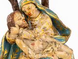 an image of a statue of a woman holding a child in her lap