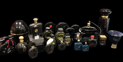 many different types of perfume bottles on a black background