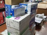 many boxes stacked on top of each other in a room
