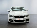 the front of a white car in a white room