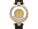a close up of a gold and diamond watch with black leather strap