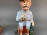 two figurines of a soldier and a dog