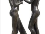 a statue of a man and a woman holding a baseball bat