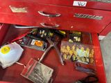 a red tool box with a lot of tools inside of it