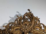a mirror that is sitting on the wall in the room