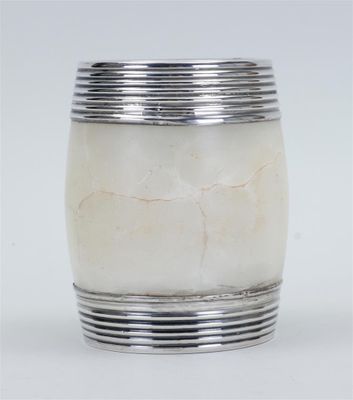silver plated vase with white marble in it on a white surface