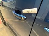 a sticker on the door handle of a blue car