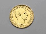 l'image d'une pièce d'or sur laquelle figure le visage d'un homme