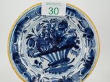 an image of a blue and white plate with a bird on it
