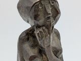 statue of a woman with a hat on her head