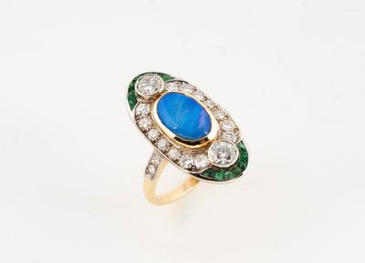 a close up of a ring with a blue stone surrounded by diamonds