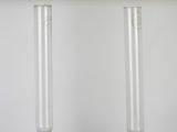 two tubes that have been filled with liquid on a table