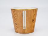 wooden cup with a white stripe on the side