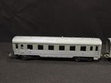 a toy train that is sitting next to a toy train