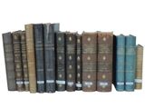 a row of old books on a white background