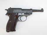 a gun that is on a table with a white background
