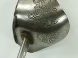 a spoon with a handle that has a design on it