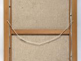 an old picture frame with a rope hanging from it ' s side