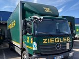 a truck that is parked in front of a building