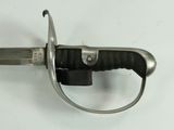 a close up of a knife with a handle on a table